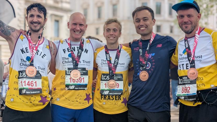 Runners with medals smiling