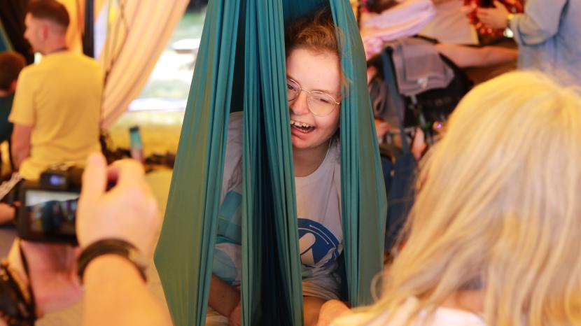 Laura using circus equipment at Big top Circus art festival.