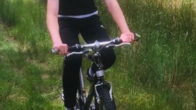 Haydn: teenager on bike wearing a helmet