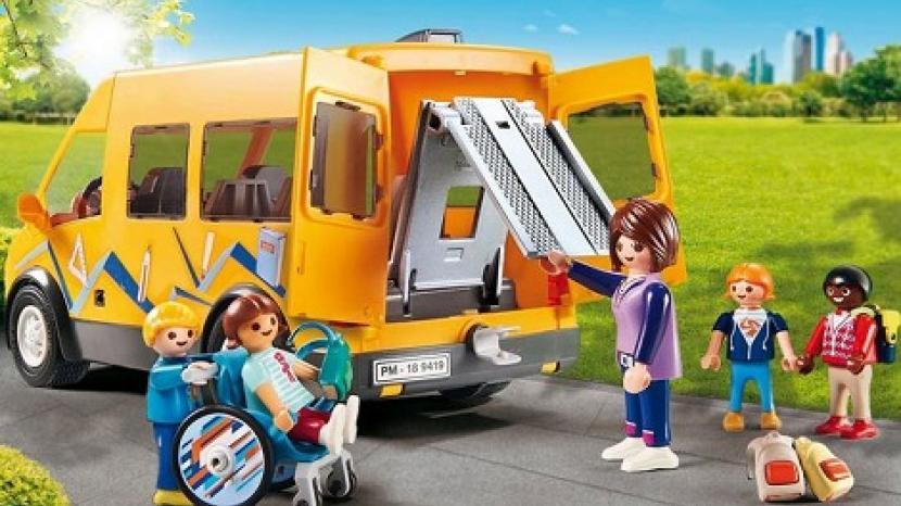playmobil figures stand around a yellow van