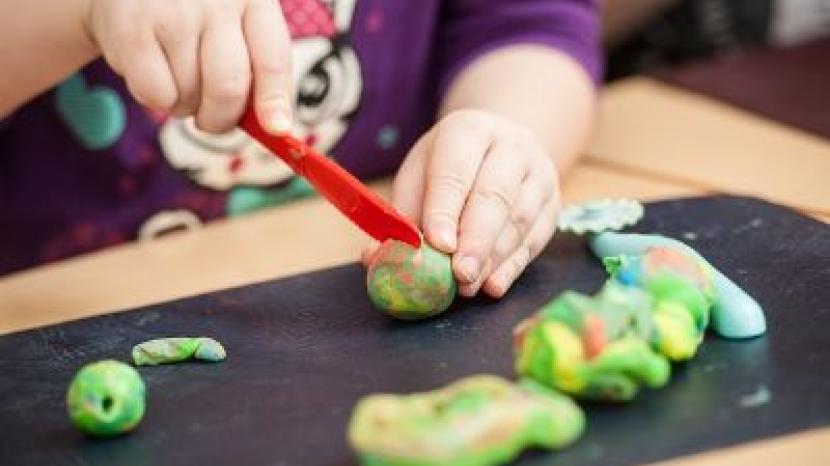 Child using play dough