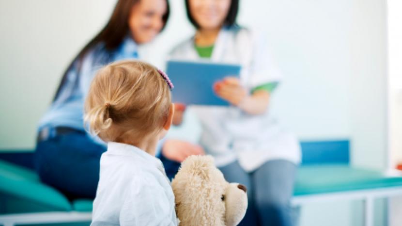 young girl looks at a doctor 