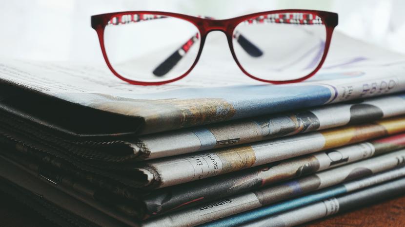 newspaper and glasses