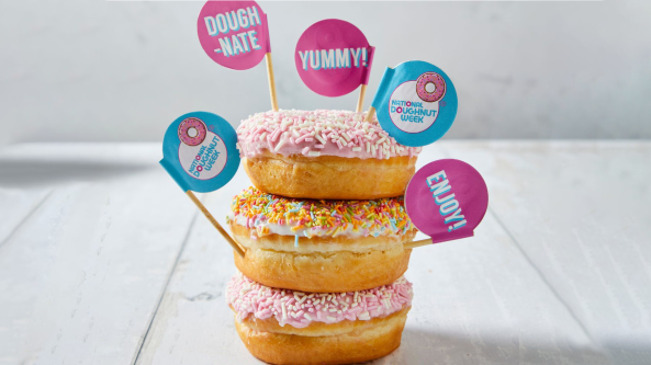 A stack of three decorated doughnuts