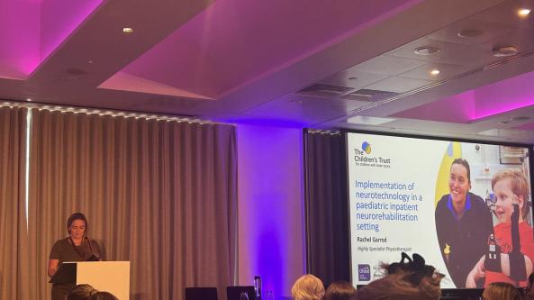 Staff member presenting at a conference