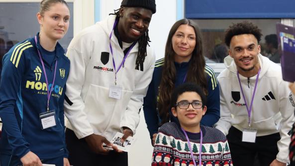 Child smiling with Fulham players